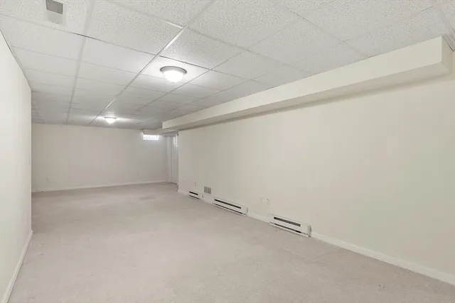 an empty room with shelves