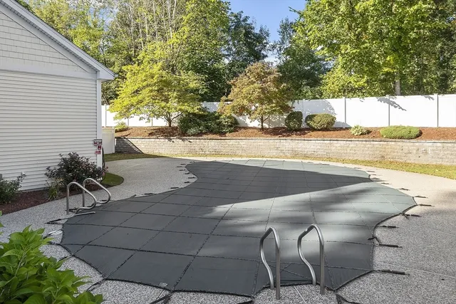 a view of a swimming pool with a patio