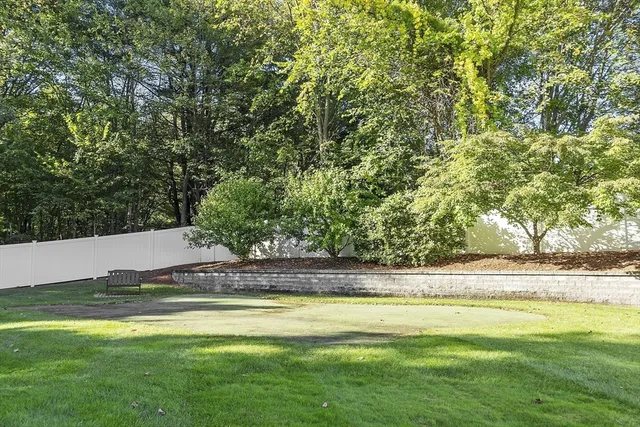 a view of a swimming pool with an outdoor space and seating area