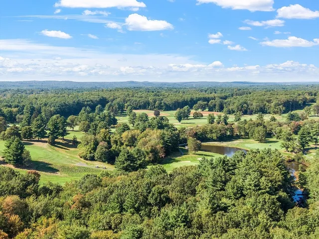 a view of a garden with an outdoor seating