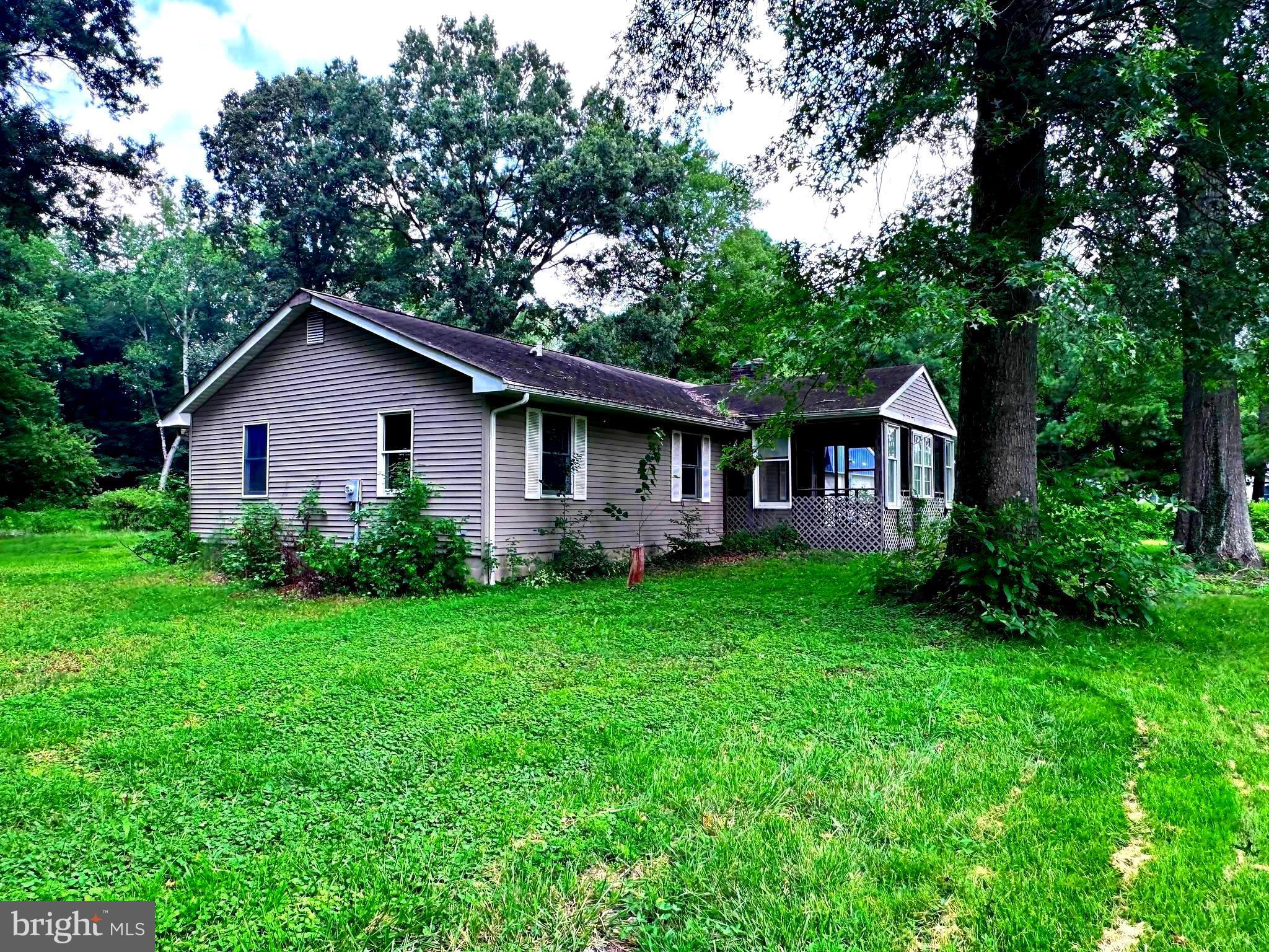 8027 Willow Grove Road Camden Wyoming, DE 19934 - Photo 2 of 16 a view of a house with backyard and garden