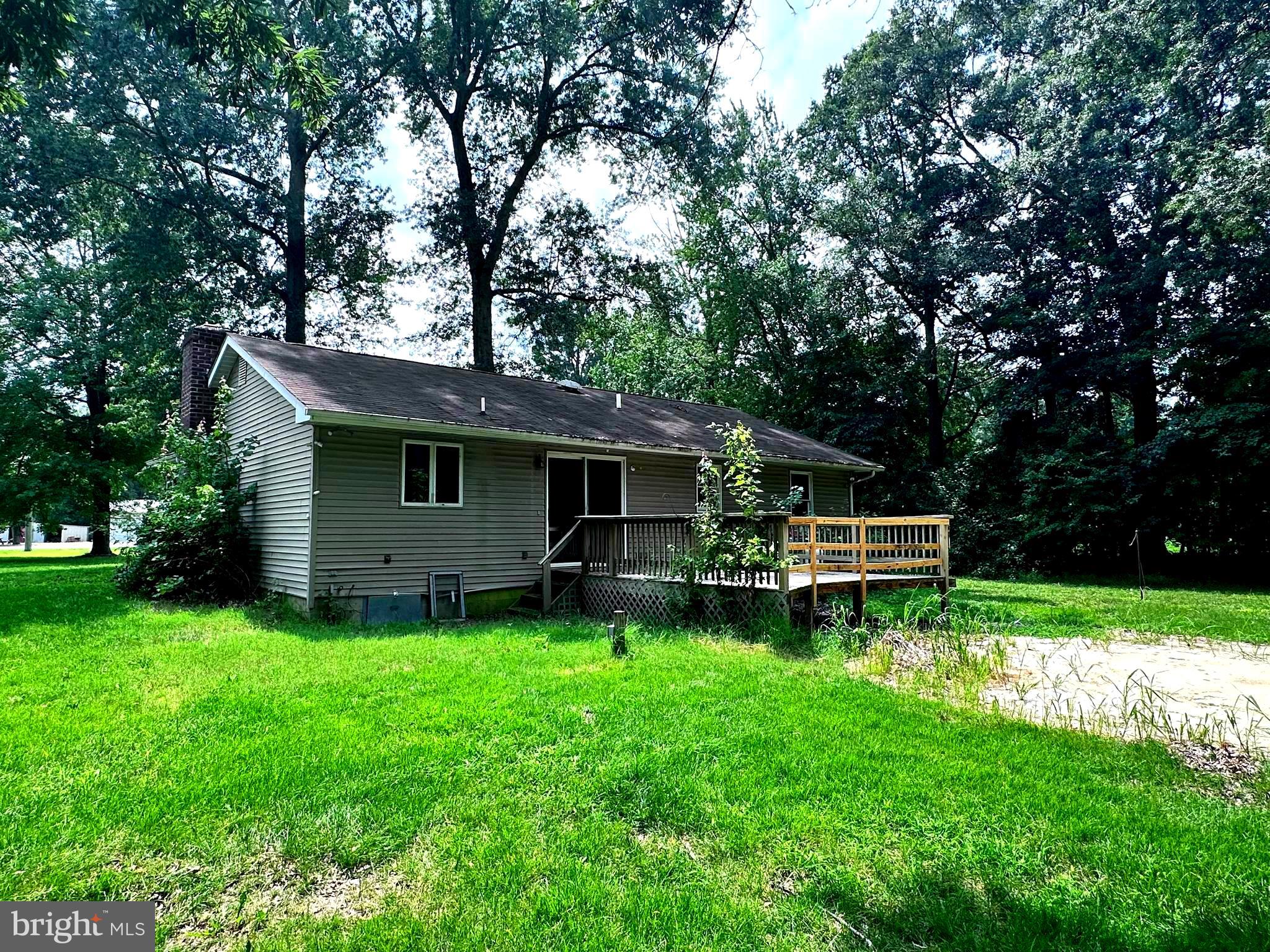 8027 Willow Grove Road Camden Wyoming, DE 19934 - Photo 3 of 16 a view of a house with a yard and sitting area