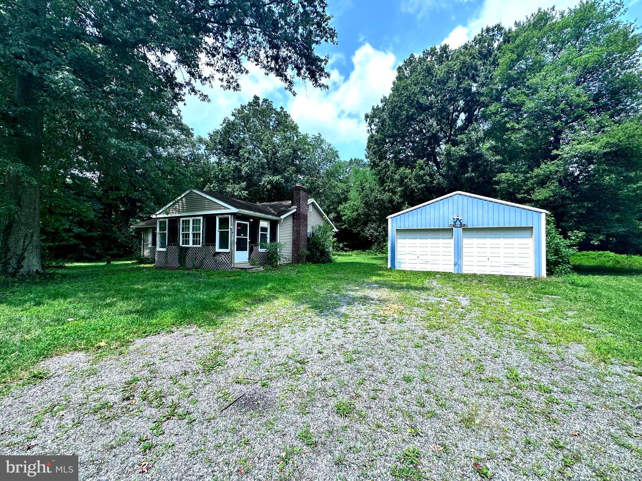 8027 Willow Grove Road Camden Wyoming, DE 19934 - Photo 6 of 16 a front view of a house with garden