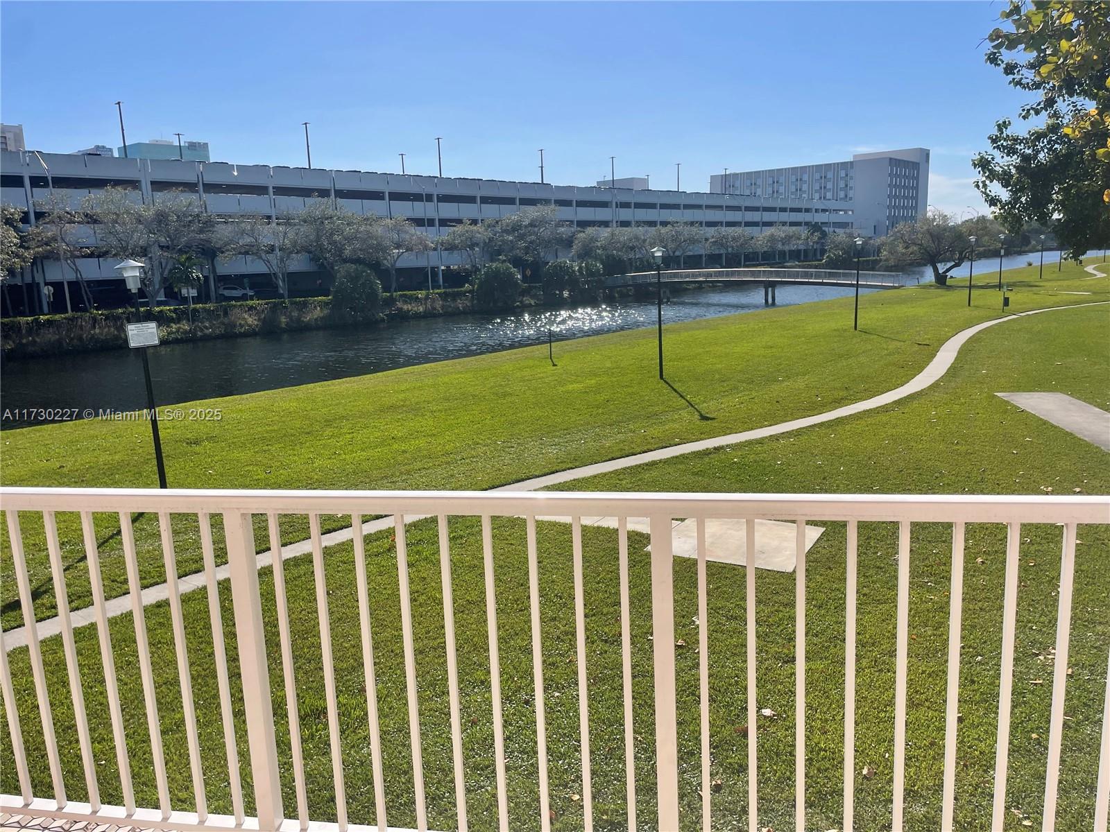 7348 Southwest 82nd Street, Unit C217 Miami, FL 33143 - Photo 1 of 19 a view of a tennis court