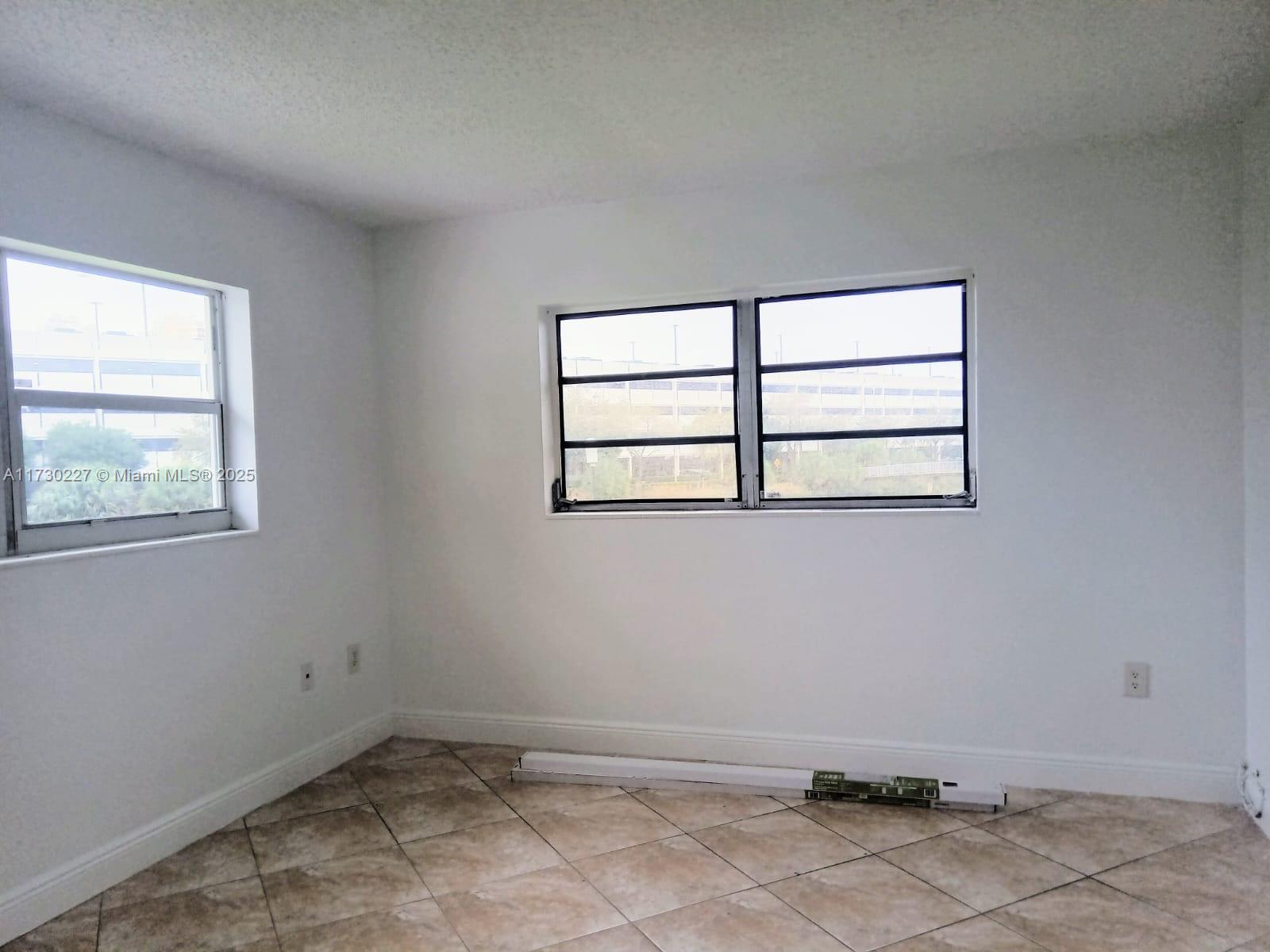 7348 Southwest 82nd Street, Unit C217 Miami, FL 33143 - Photo 13 of 19 a view of a room that has a window in it