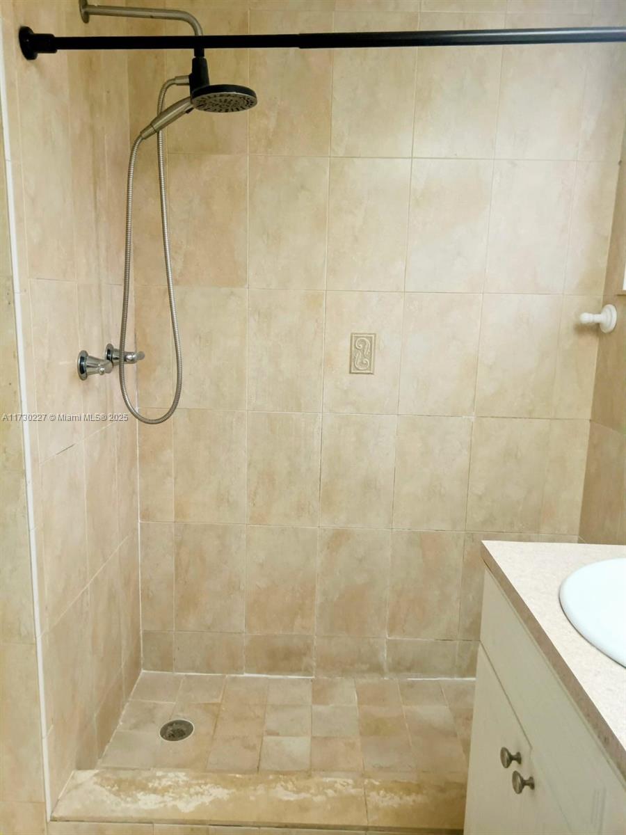 7348 Southwest 82nd Street, Unit C217 Miami, FL 33143 - Photo 15 of 19 a bathroom with a shower