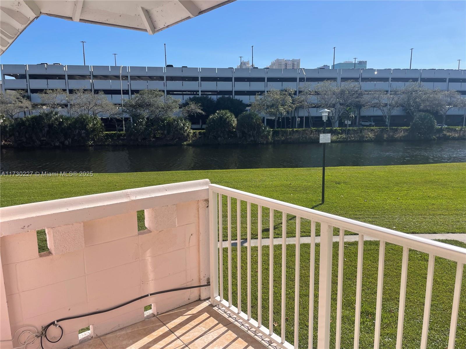 7348 Southwest 82nd Street, Unit C217 Miami, FL 33143 - Photo 18 of 19 a view of a swimming pool with a lake view