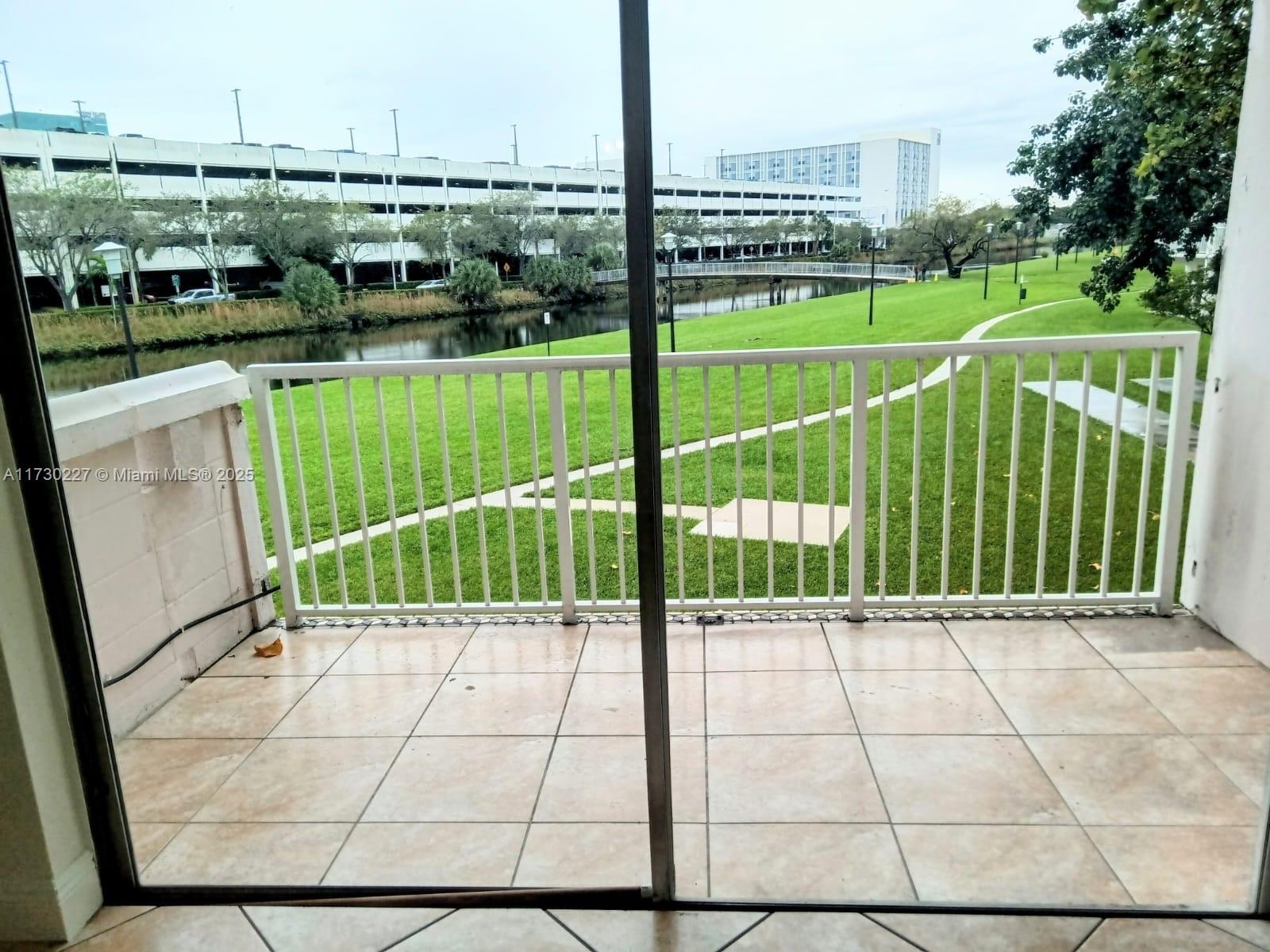 7348 Southwest 82nd Street, Unit C217 Miami, FL 33143 - Photo 4 of 19 a view of a garden