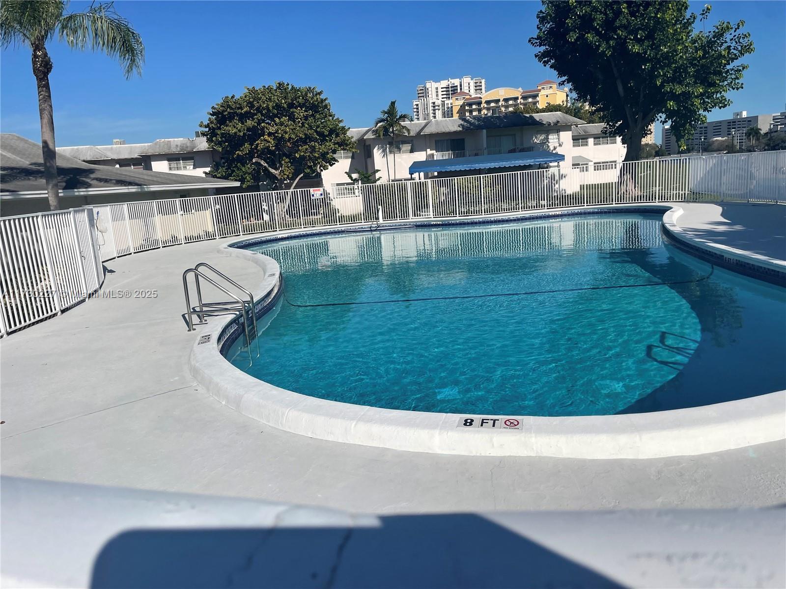 7348 Southwest 82nd Street, Unit C217 Miami, FL 33143 - Photo 5 of 19 a view of a swimming pool