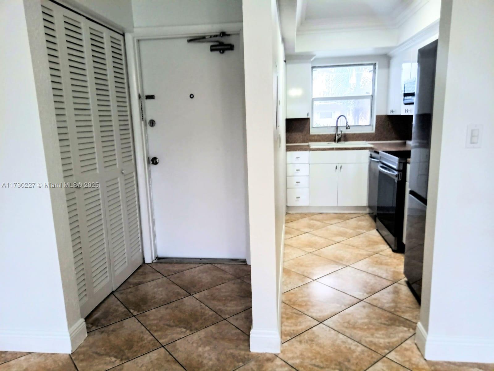 7348 Southwest 82nd Street, Unit C217 Miami, FL 33143 - Photo 7 of 19 a view of a kitchen with a sink