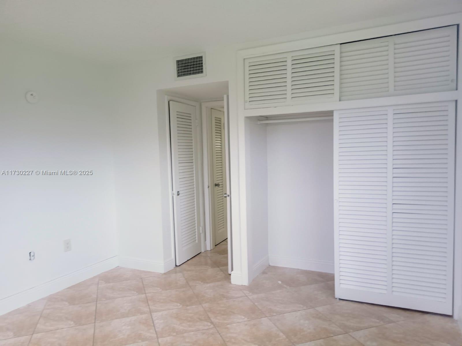 7348 Southwest 82nd Street, Unit C217 Miami, FL 33143 - Photo 9 of 19 a view of an empty room