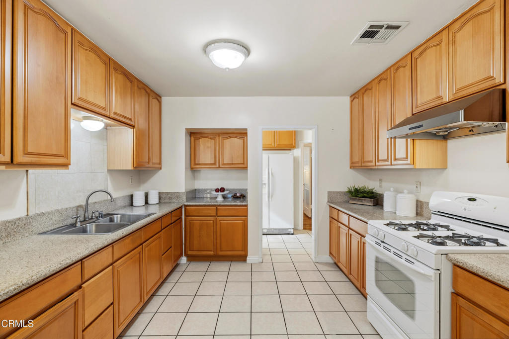 1809 South Palm Avenue Alhambra, CA 91803 - Photo 16 of 44 a kitchen with a sink a stove and cabinets
