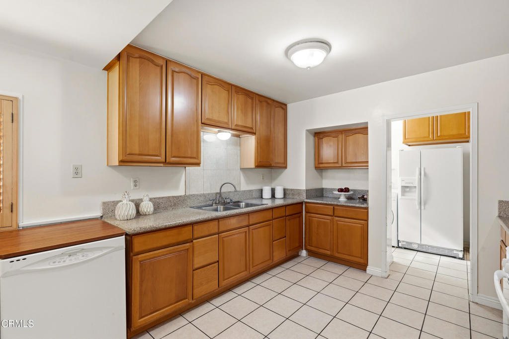 1809 South Palm Avenue Alhambra, CA 91803 - Photo 18 of 44 a kitchen with stainless steel appliances granite countertop a sink and cabinets