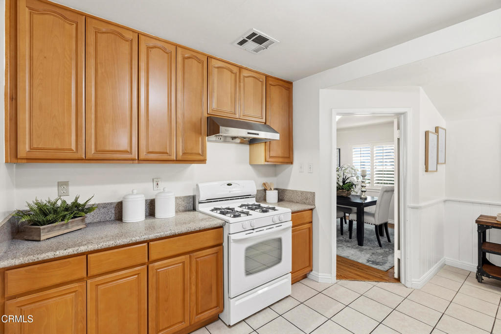 1809 South Palm Avenue Alhambra, CA 91803 - Photo 20 of 44 a kitchen with stainless steel appliances granite countertop a stove a sink and a microwave