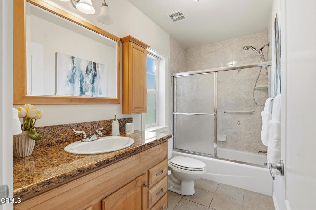 1809 South Palm Avenue Alhambra, CA 91803 - Photo 29 of 44 a bathroom with a granite countertop sink toilet and shower