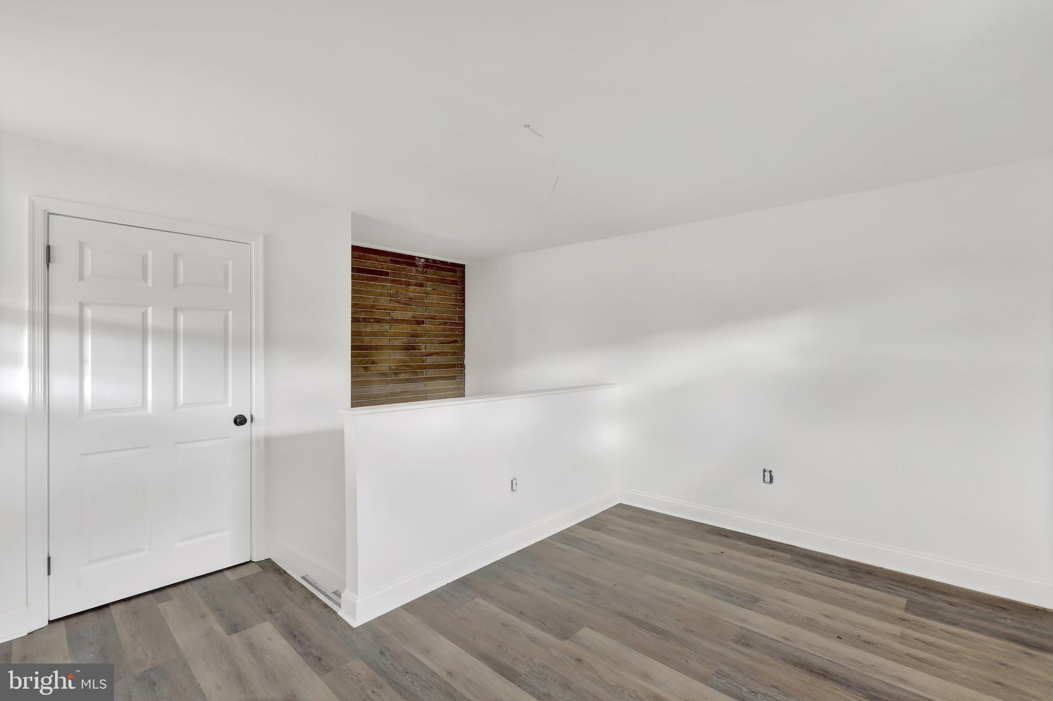 664 South Breezewood Road Breezewood, PA 15533 - Photo 15 of 24 a view of an empty room with wooden floor