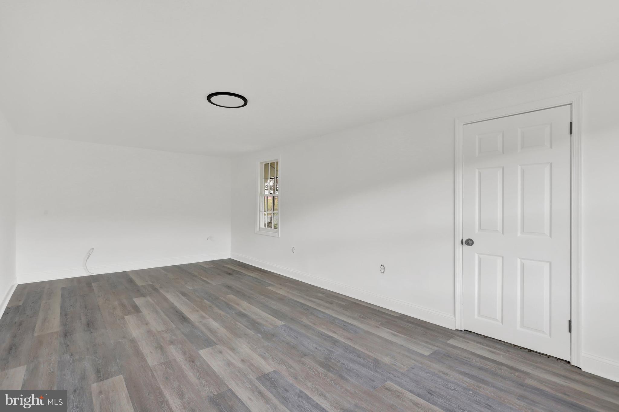 664 South Breezewood Road Breezewood, PA 15533 - Photo 5 of 24 a view of a room with wooden floor