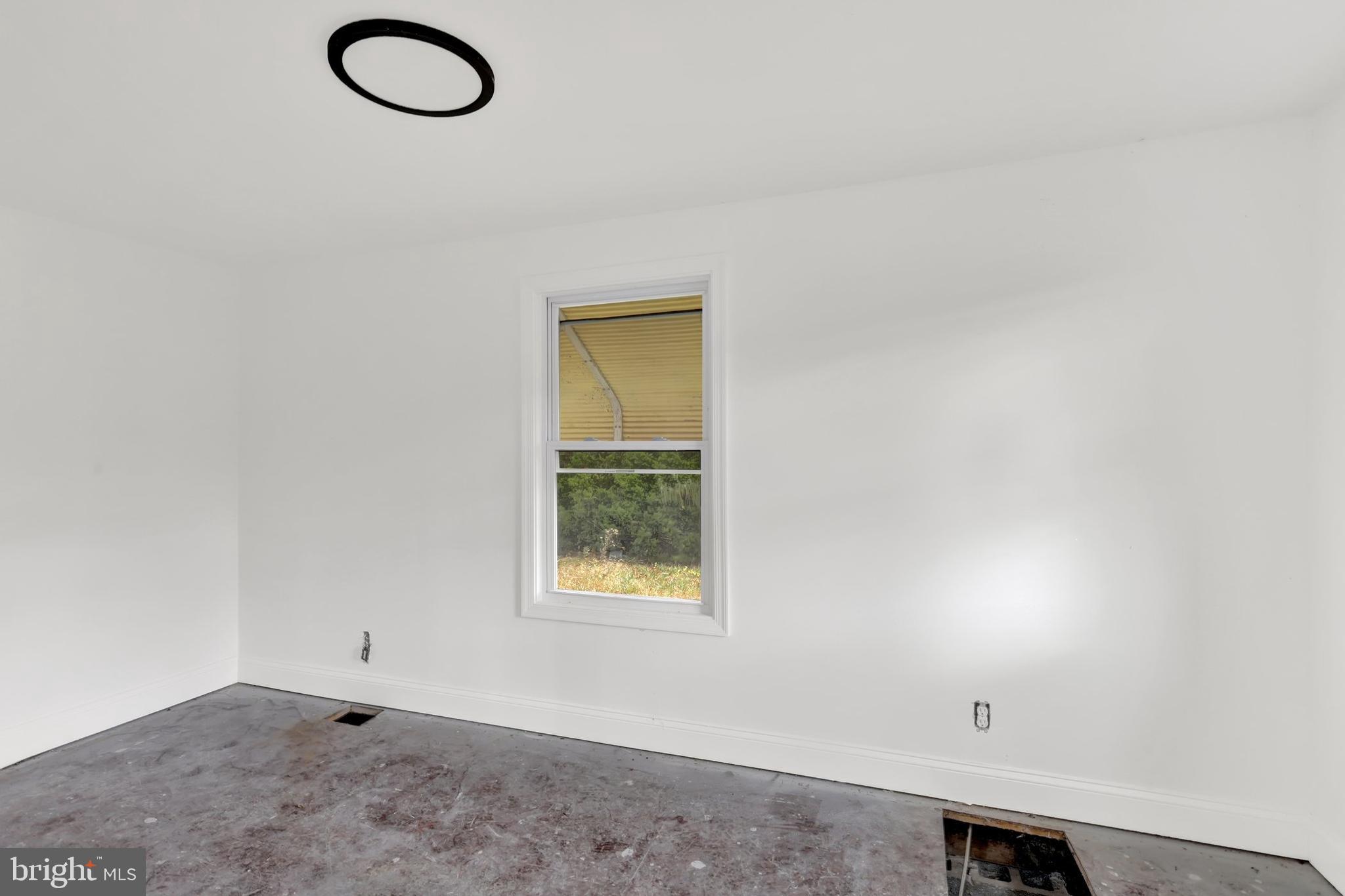 664 South Breezewood Road Breezewood, PA 15533 - Photo 7 of 24 an empty room with a window