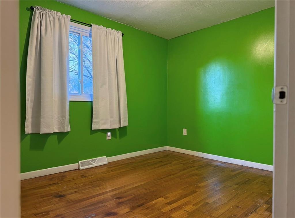 464 State Rte 1027 Kittanning, PA 16201 - Photo 21 of 24 a view of a room with wooden floor and windows