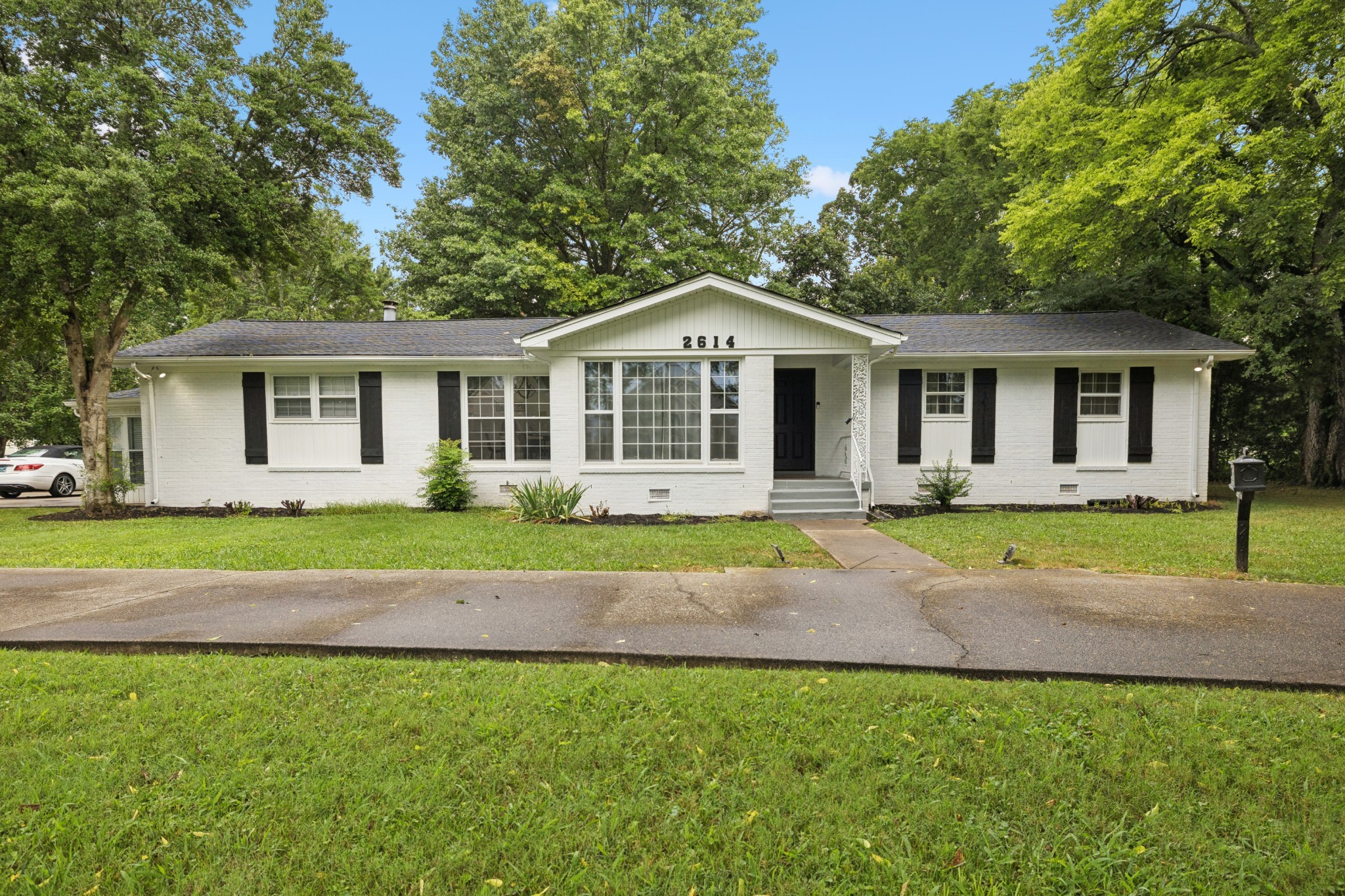 2614 Elam Road Murfreesboro, TN 37127 - Photo 11 of 97 a view of a house with a backyard and a tree