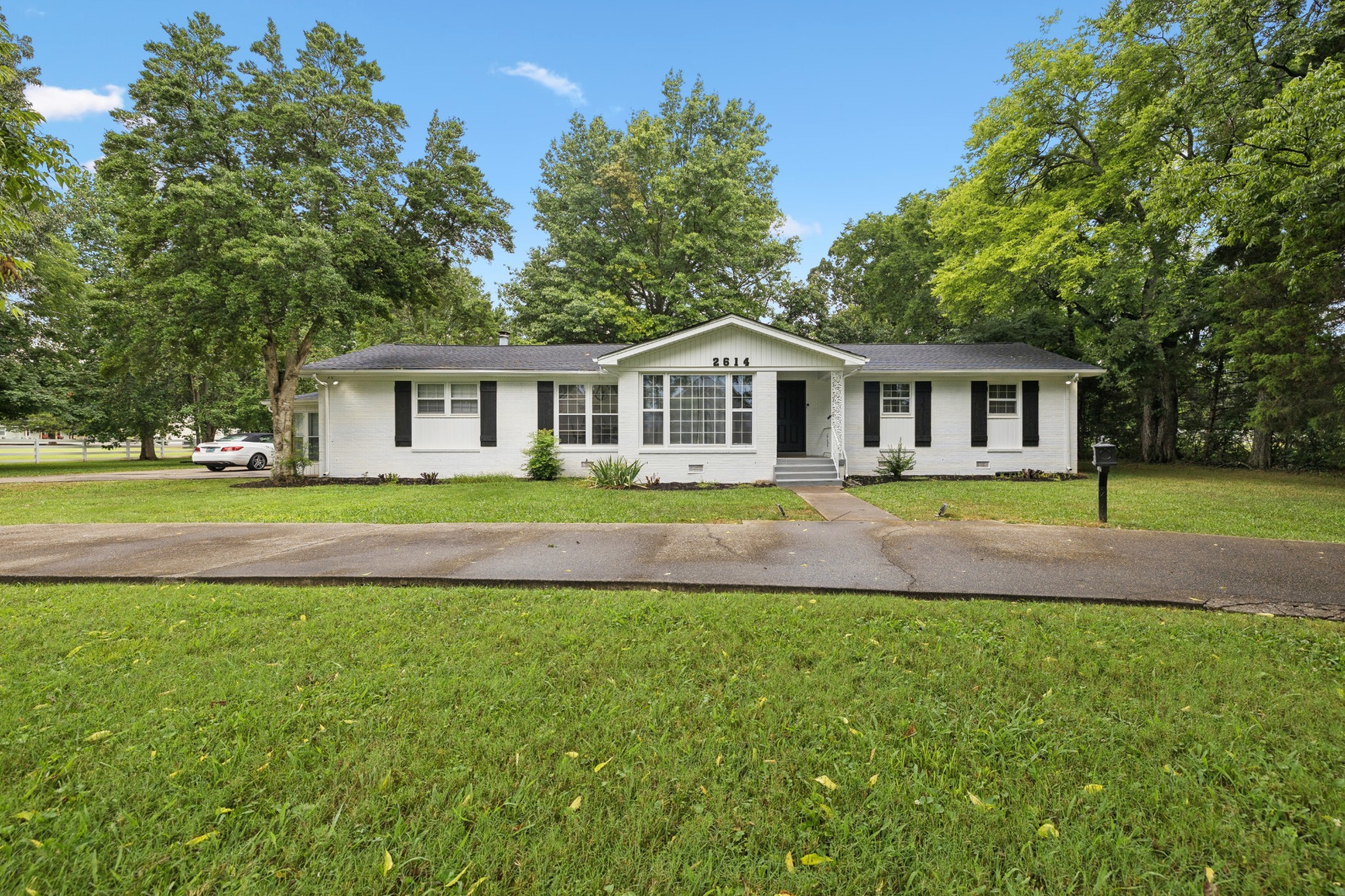 2614 Elam Road Murfreesboro, TN 37127 - Photo 2 of 97 a front view of a house with a swimming pool