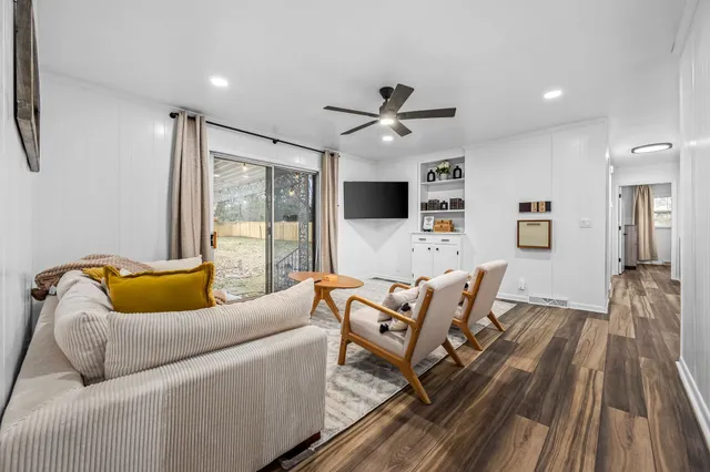 a view of a garden with large trees