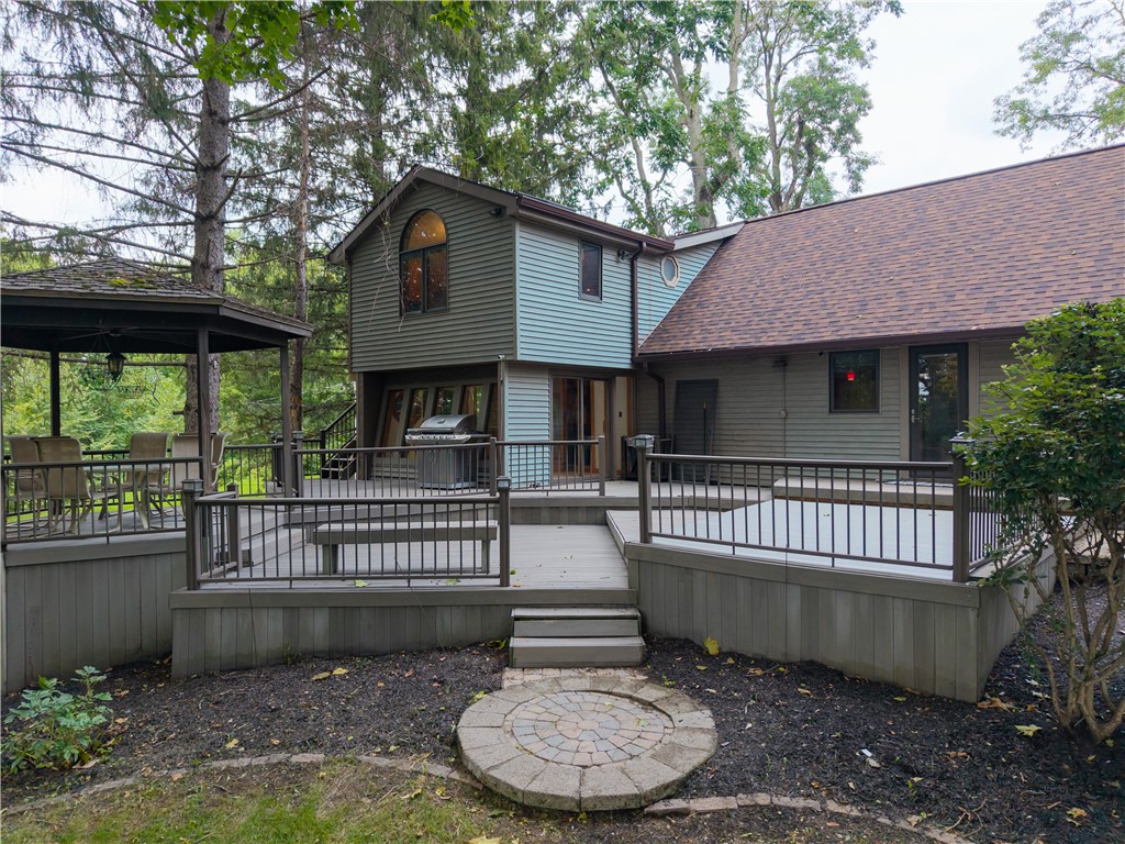 301 Spring Street Avon, NY 14414 - Photo 4 of 50 Pavers, multi-tiered composite deck, rear entrance to house