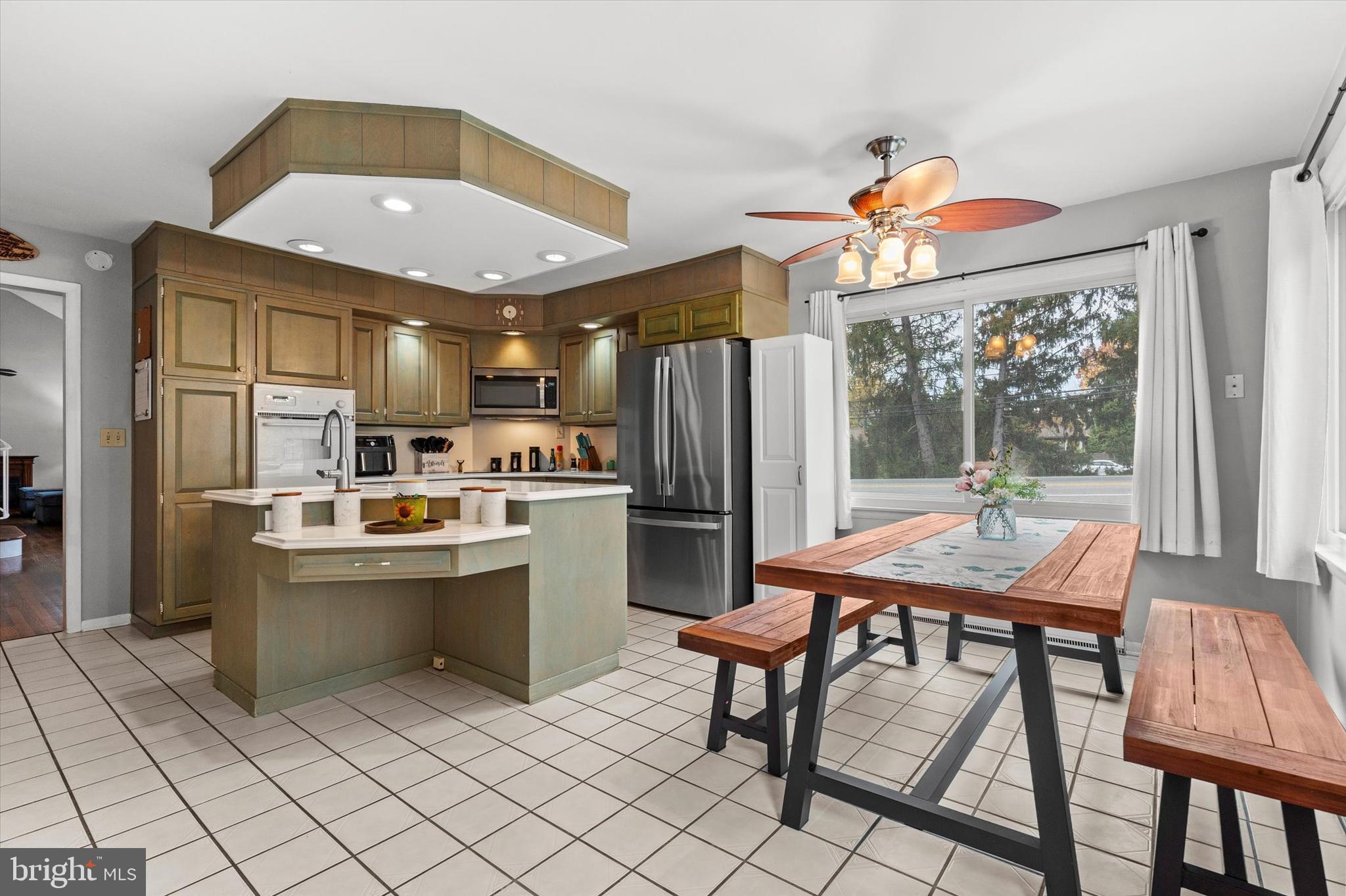 1605 Colonial Road Harrisburg, PA 17112 - Photo 12 of 39 a kitchen with a table chairs refrigerator and furniture
