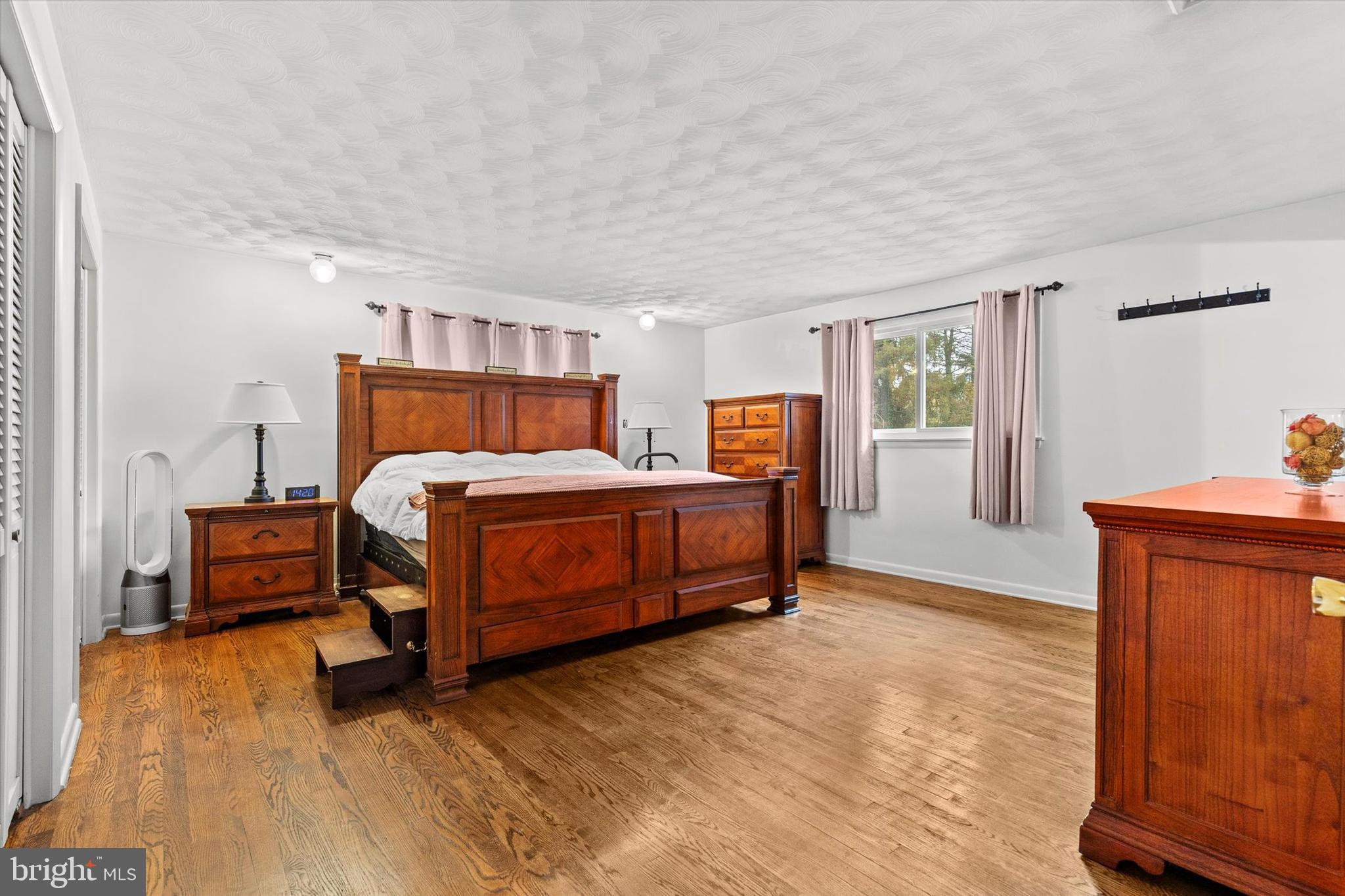 1605 Colonial Road Harrisburg, PA 17112 - Photo 18 of 39 a bedroom with a bed and wooden floor