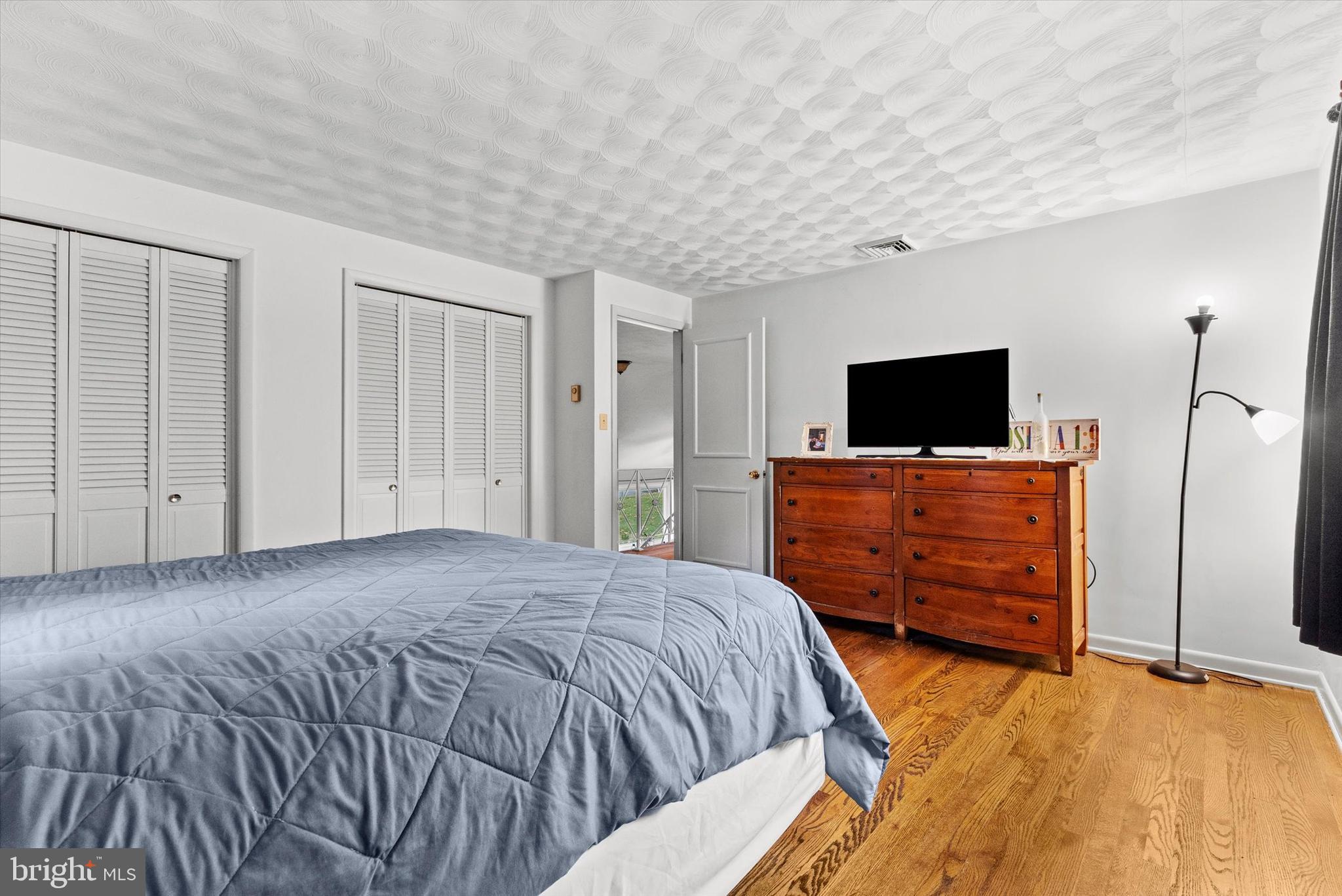 1605 Colonial Road Harrisburg, PA 17112 - Photo 25 of 39 a bedroom with a bed and a flat screen tv