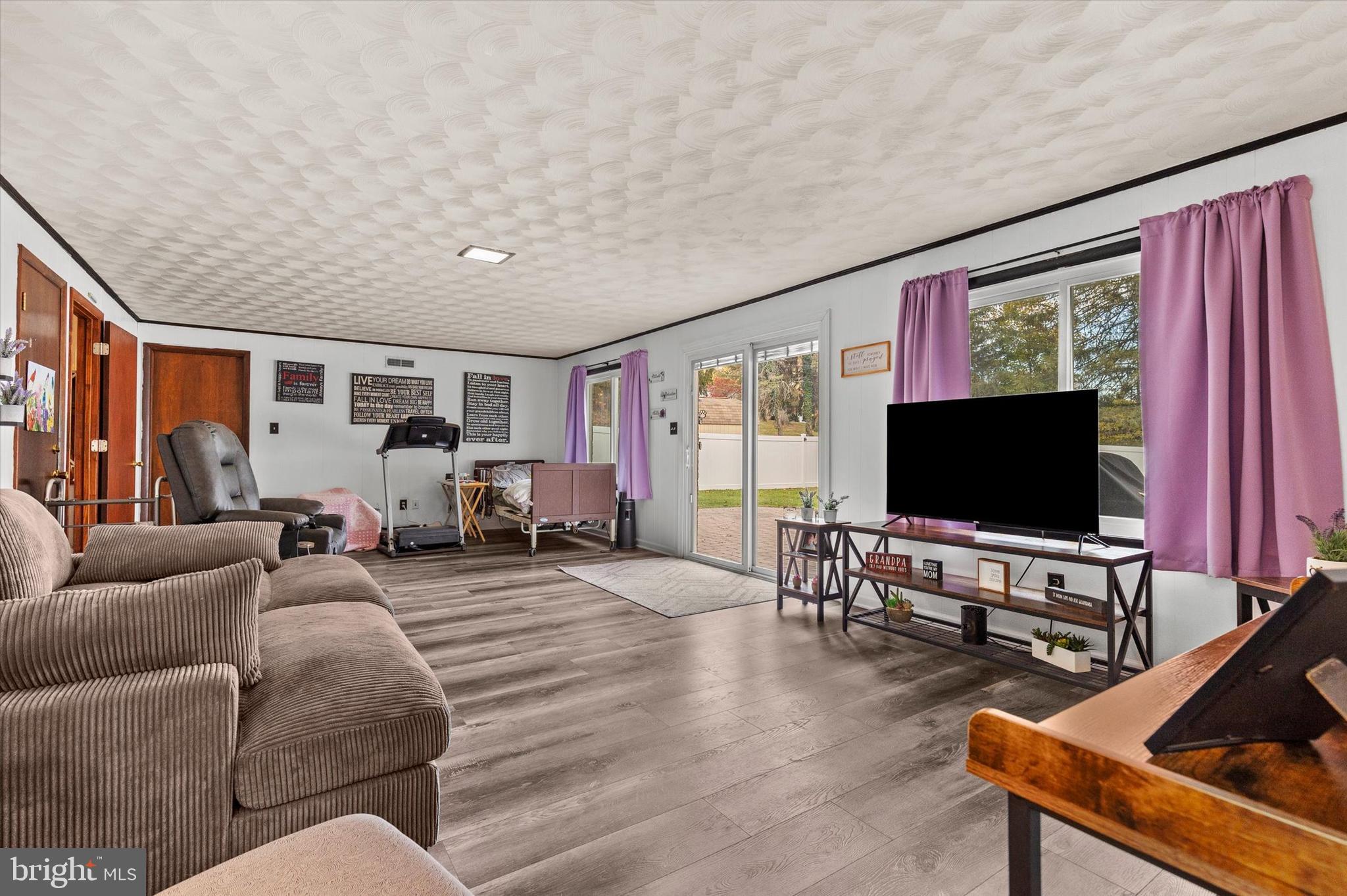 1605 Colonial Road Harrisburg, PA 17112 - Photo 27 of 39 a living room with furniture and a flat screen tv
