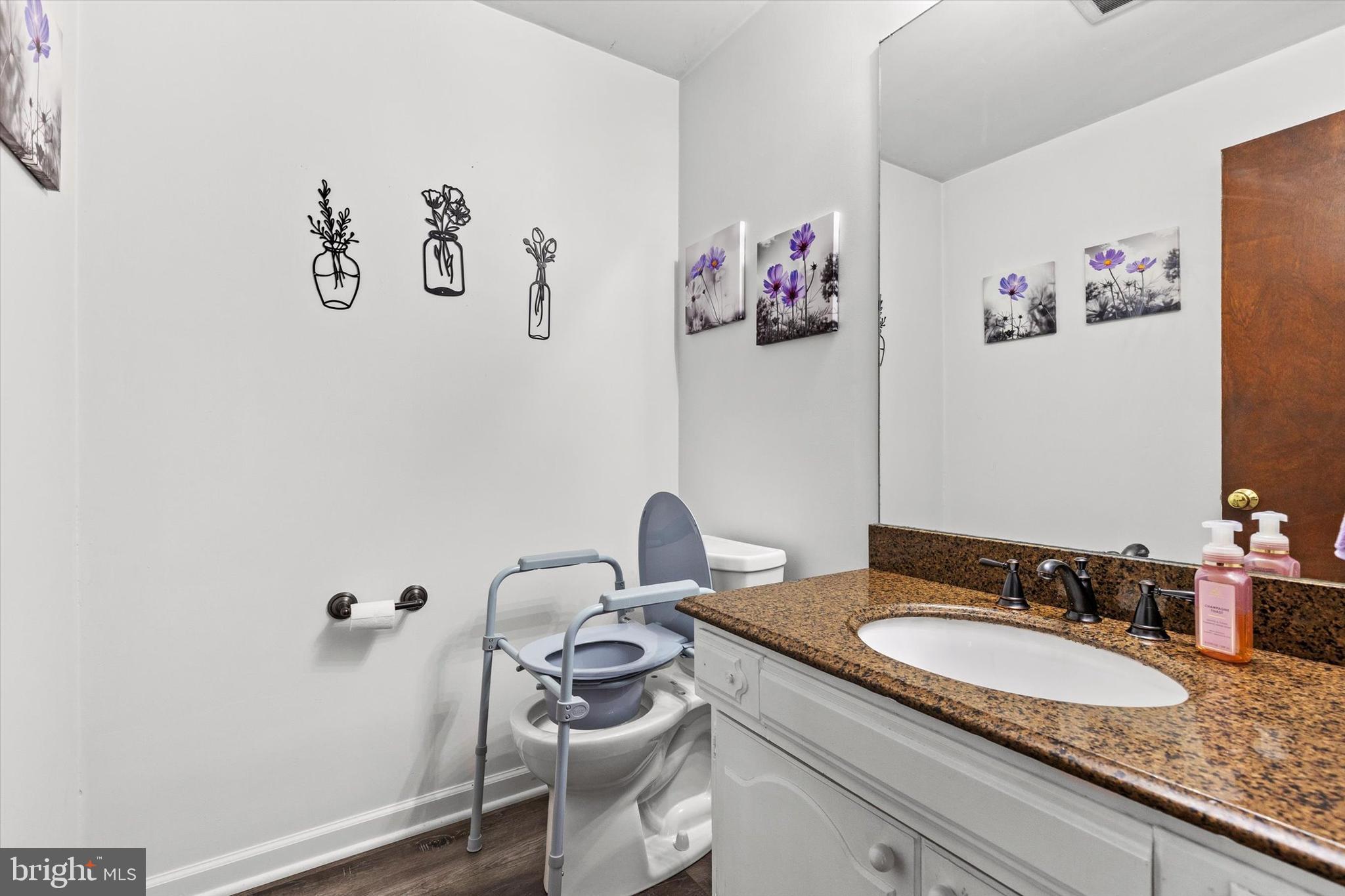 1605 Colonial Road Harrisburg, PA 17112 - Photo 28 of 39 a bathroom with a granite countertop sink and a mirror