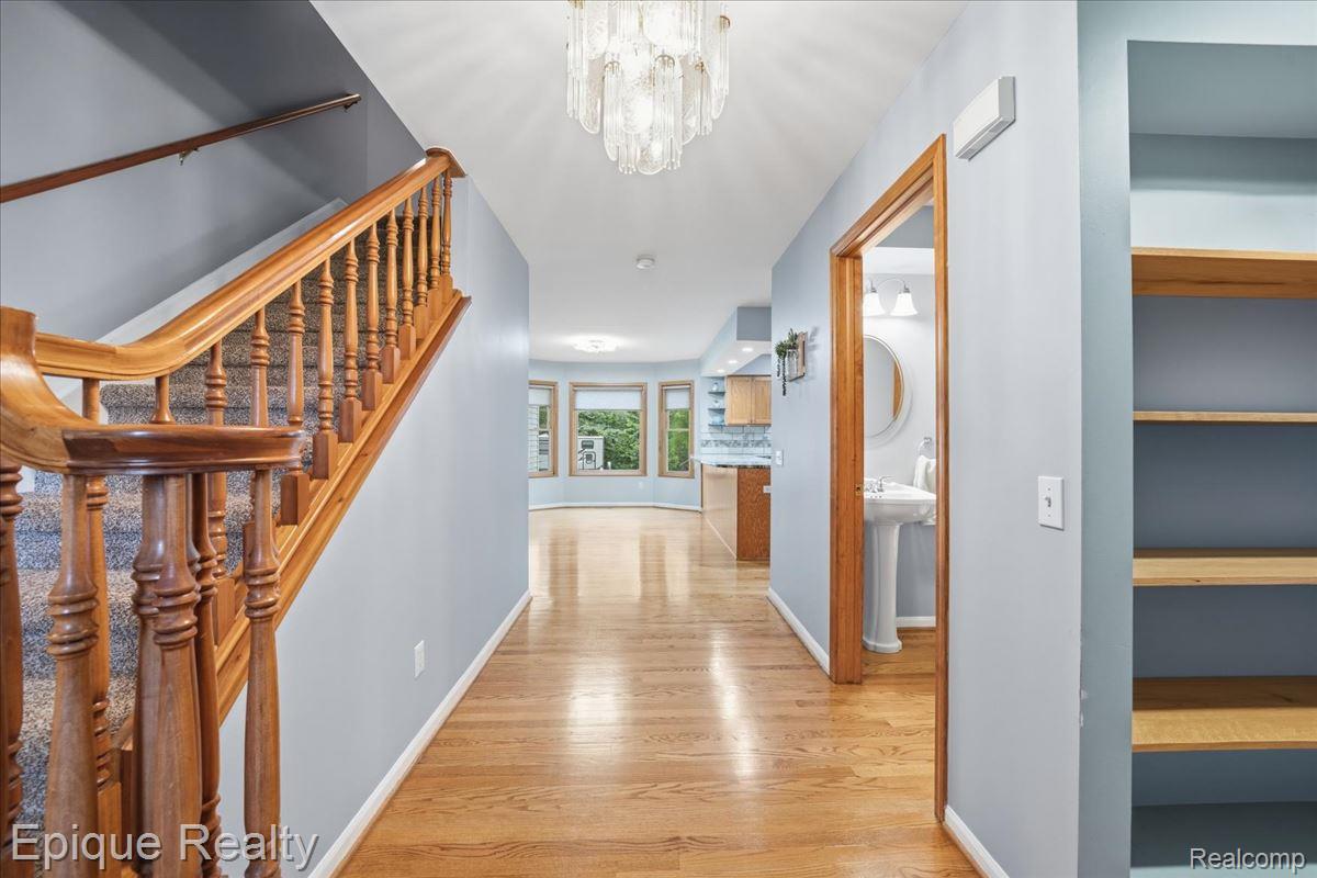 1221 Rhodes Road Lake Orion, MI 48360 - Photo 9 of 72 Hardwood flooring throughout the hallway