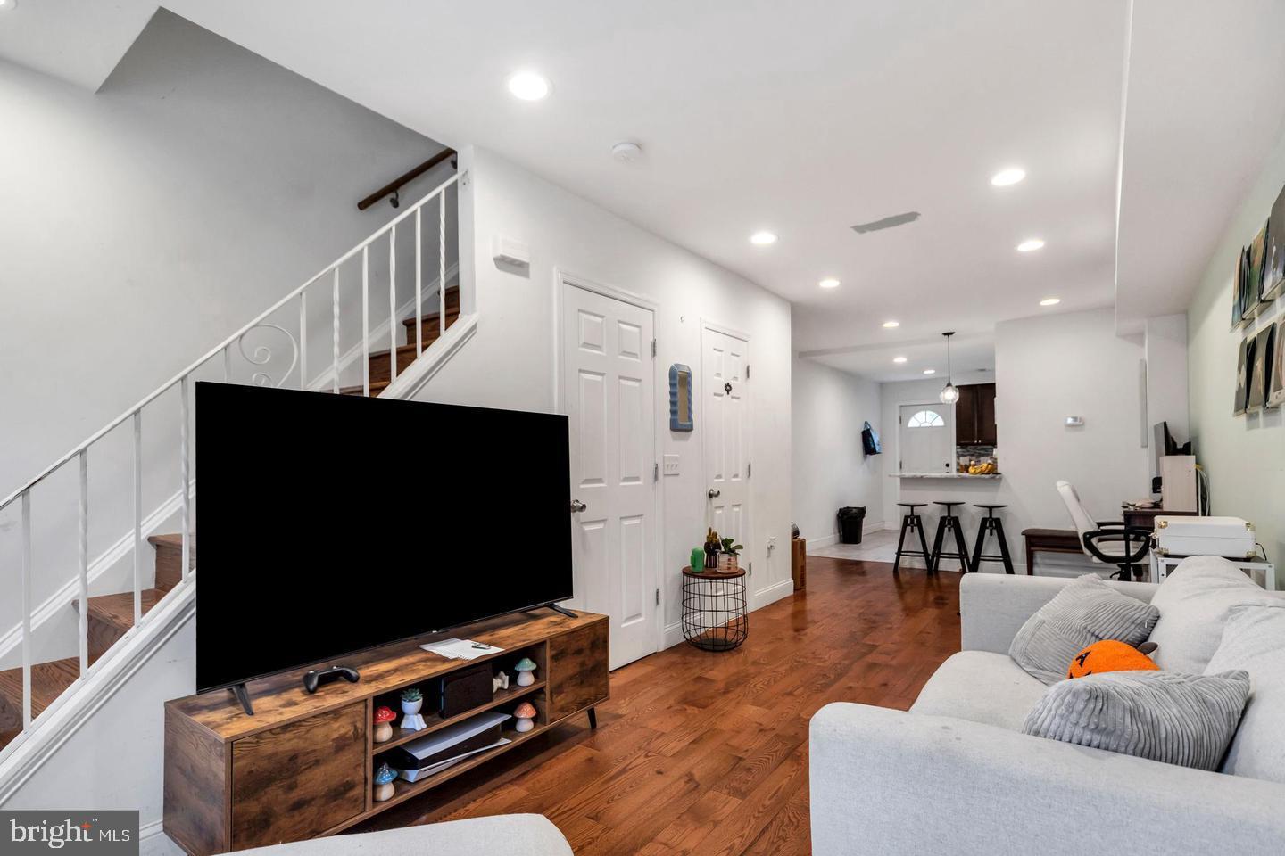 1833 East Albert Street Philadelphia, PA 19125 - Photo 3 of 13 a living room with furniture and a flat screen tv