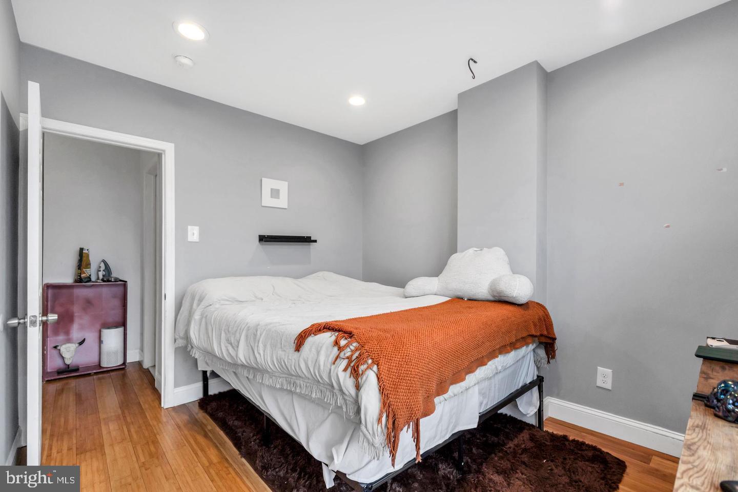 1833 East Albert Street Philadelphia, PA 19125 - Photo 7 of 13 a bedroom with a bed and a lamp