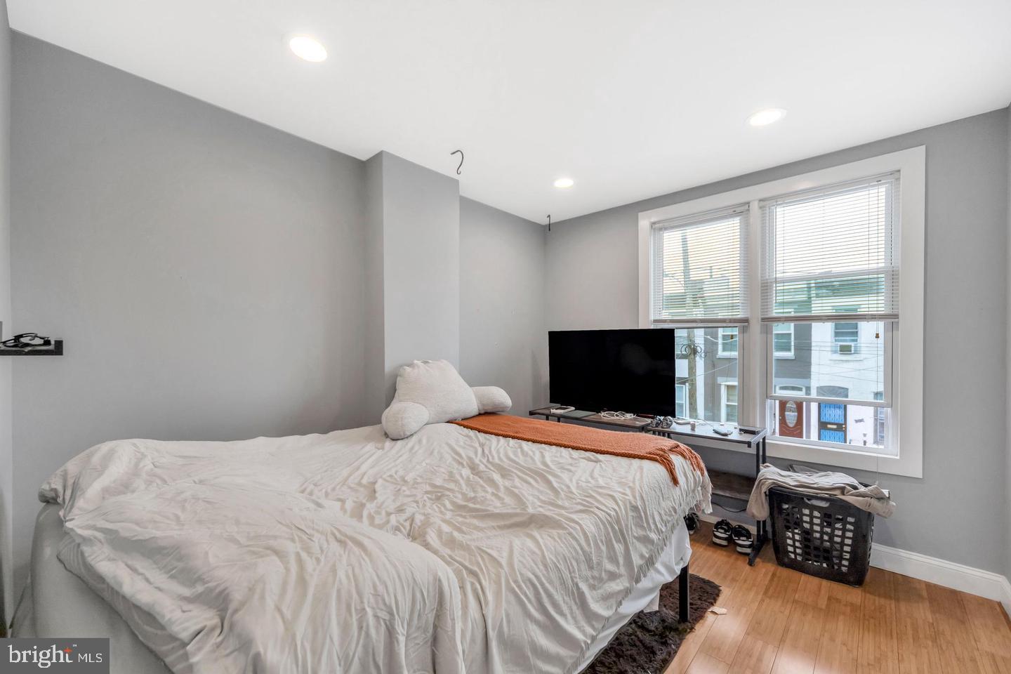 1833 East Albert Street Philadelphia, PA 19125 - Photo 8 of 13 a bedroom with a bed and wooden floor