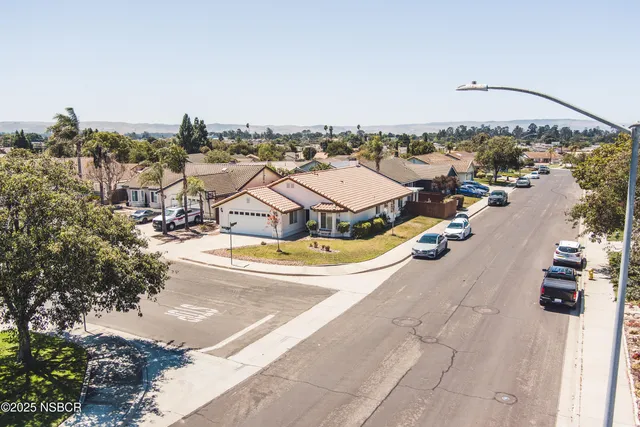 an aerial view of a house with outdoor space