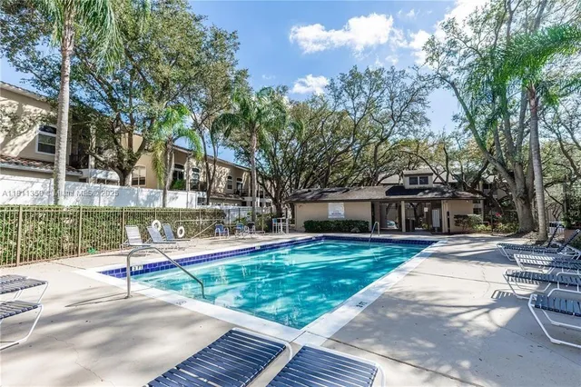 a house with trees in the background