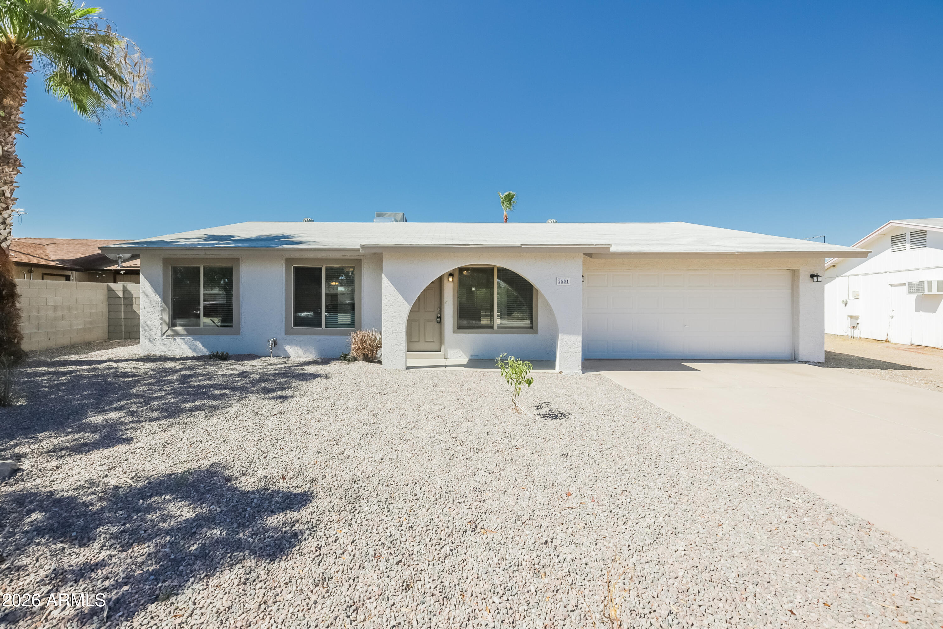 2501 East Villa Rita Drive Phoenix, AZ 85032 - Photo 1 of 15 a front view of a house with a yard