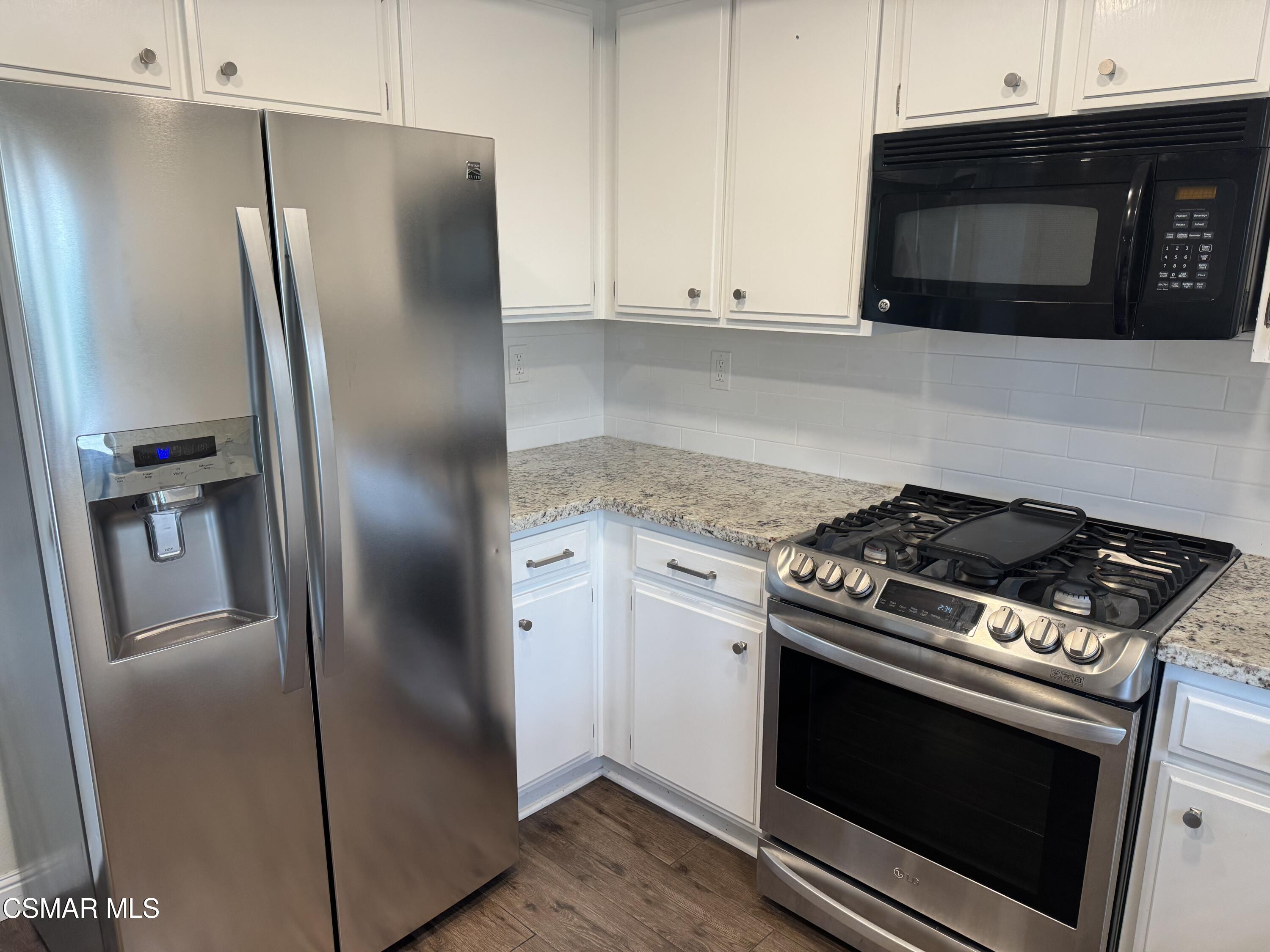 26914 Deerweed Trail Calabasas, CA 91301 - Photo 12 of 37 a stove top oven sitting inside of a kitchen