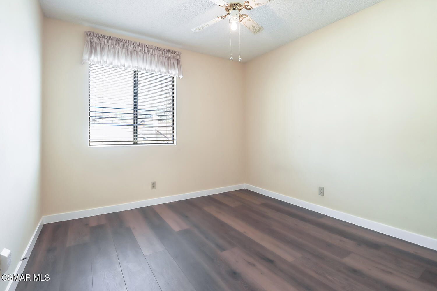 26914 Deerweed Trail Calabasas, CA 91301 - Photo 36 of 37 an empty room with wooden floor and windows