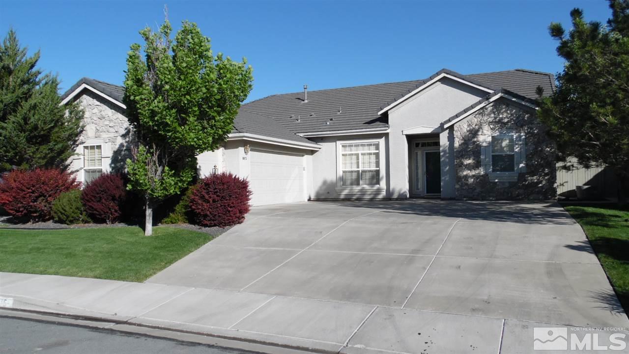 10675 Sterling Ridge Way Reno, NV 89521 - Photo 1 of 1 a front view of a house with a yard and a garage