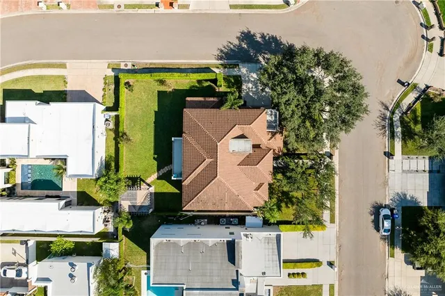 an aerial view of houses with outdoor space