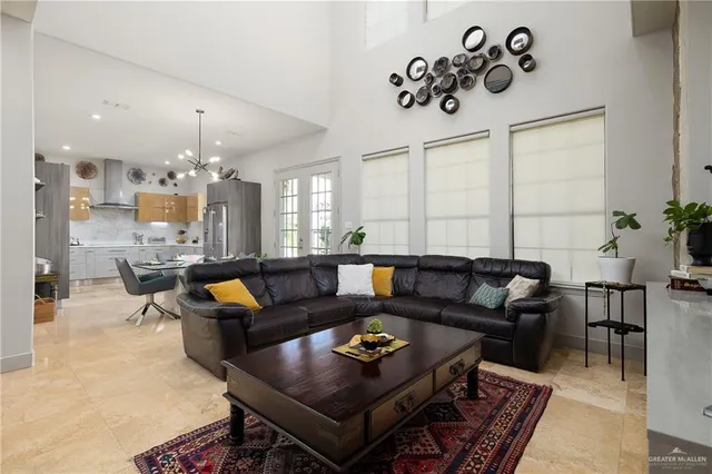 a living room with furniture and kitchen view