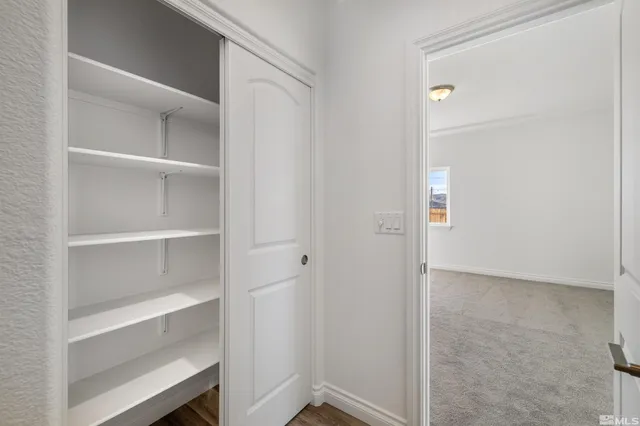 a view of an empty walk in closet