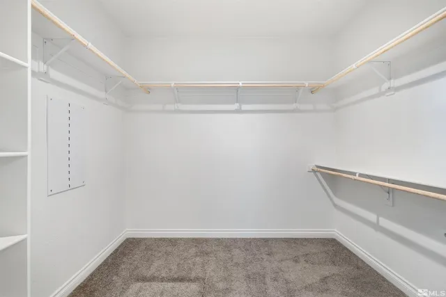 a view of an empty walk in closet
