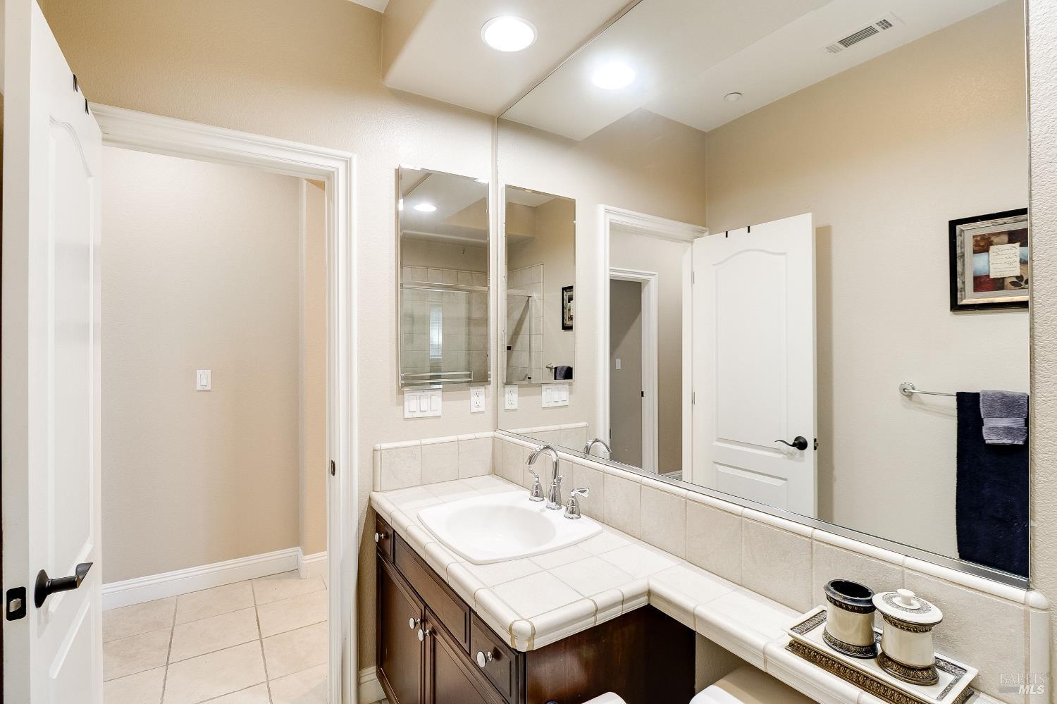 5325 Carole Ridge Court Fairfield, CA 94534 - Photo 13 of 75 a bathroom with a sink and a mirror
