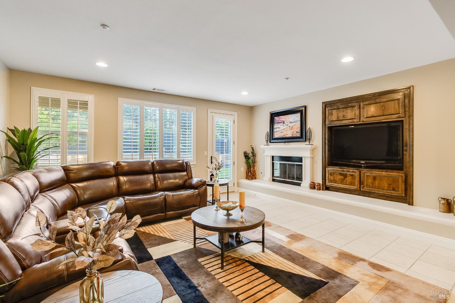 5325 Carole Ridge Court Fairfield, CA 94534 - Photo 21 of 75 a living room with furniture a flat screen tv and a fireplace