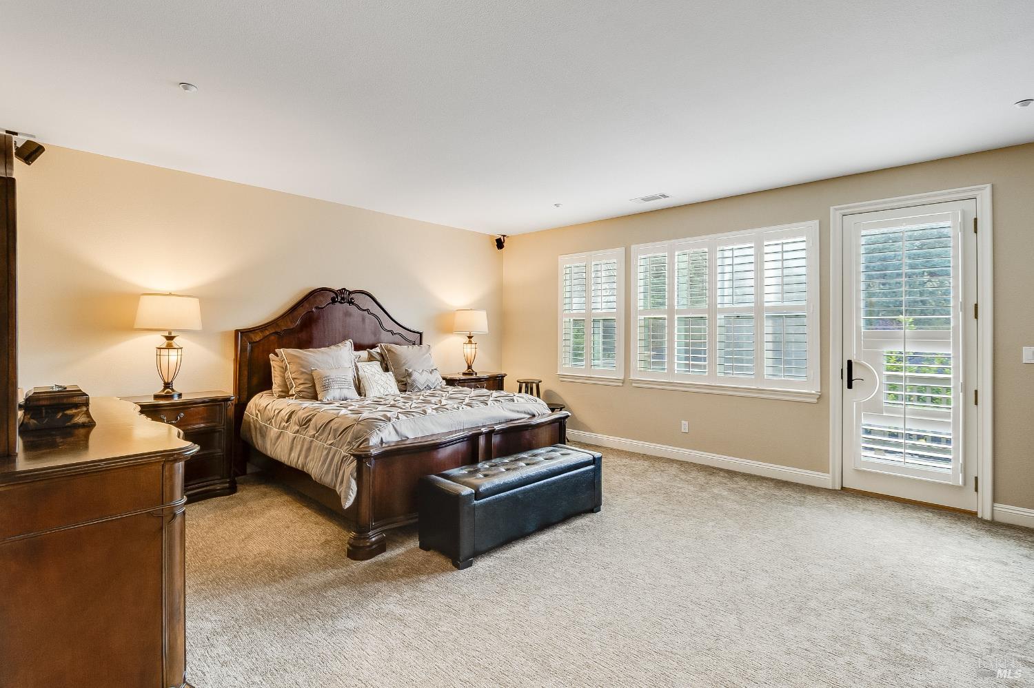5325 Carole Ridge Court Fairfield, CA 94534 - Photo 39 of 75 a spacious bedroom with a bed and a cabinets