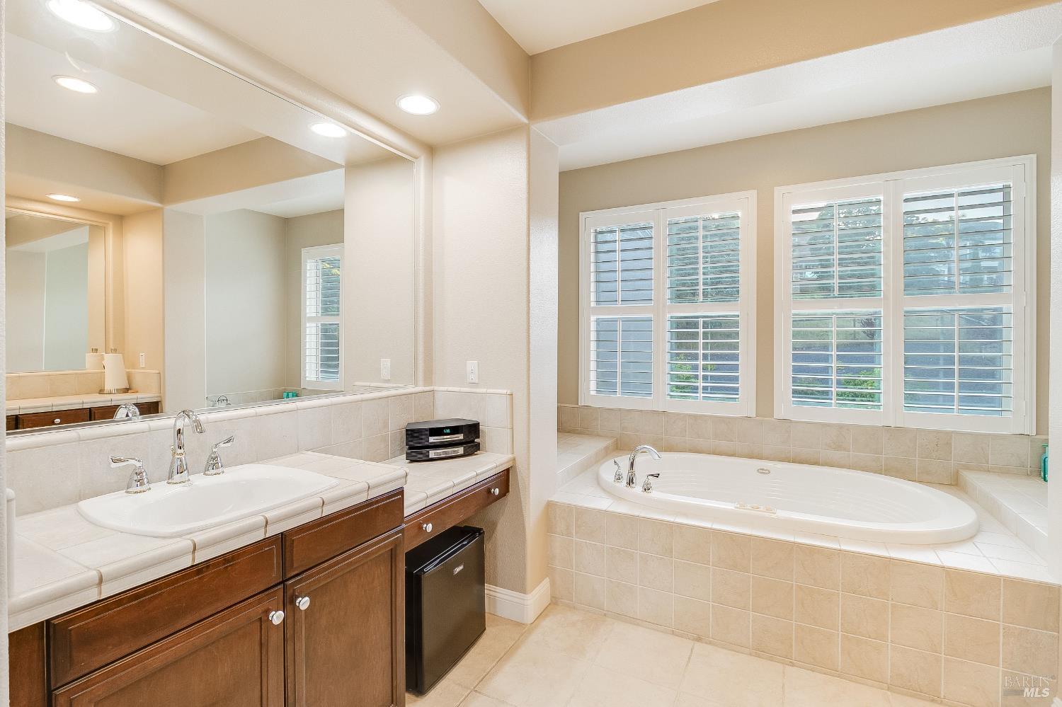 5325 Carole Ridge Court Fairfield, CA 94534 - Photo 44 of 75 a spacious bathroom with a tub sink and mirror